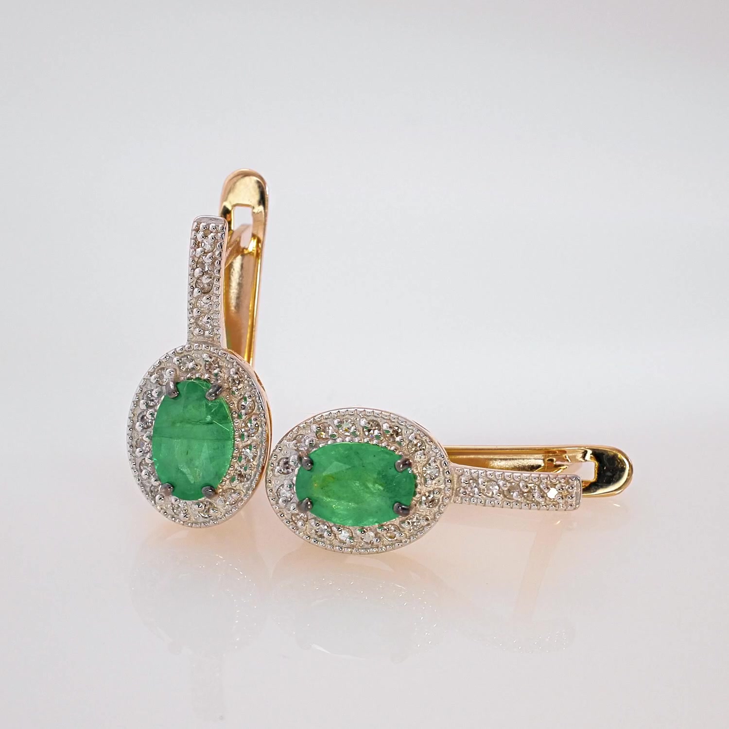 Золотые серьги с изумрудами и бриллиантами