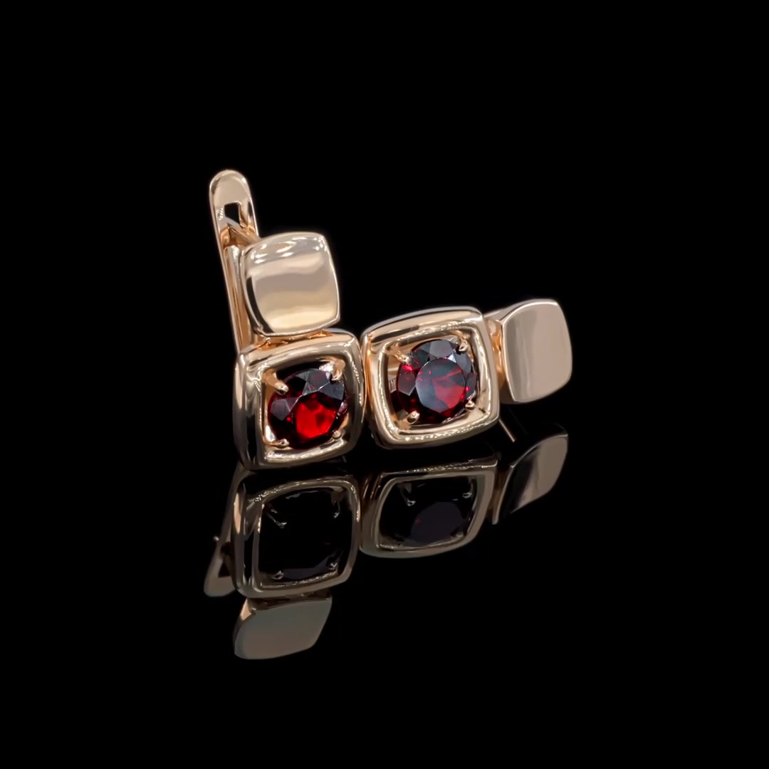 Золотые серьги с гранатом