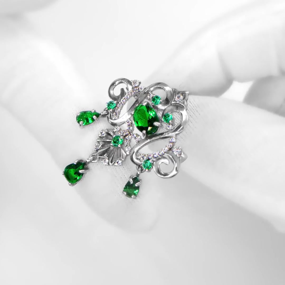 Серебряная брошь с ювелирными кристаллами и фианитами с родированием